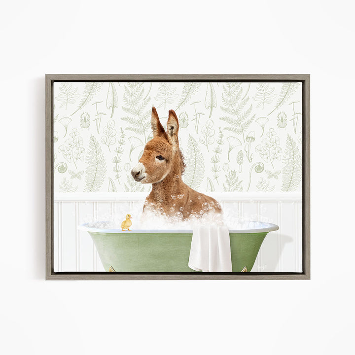 A donkey is sitting in a green bathtub filled with water, surrounded by a patterned wallpaper.