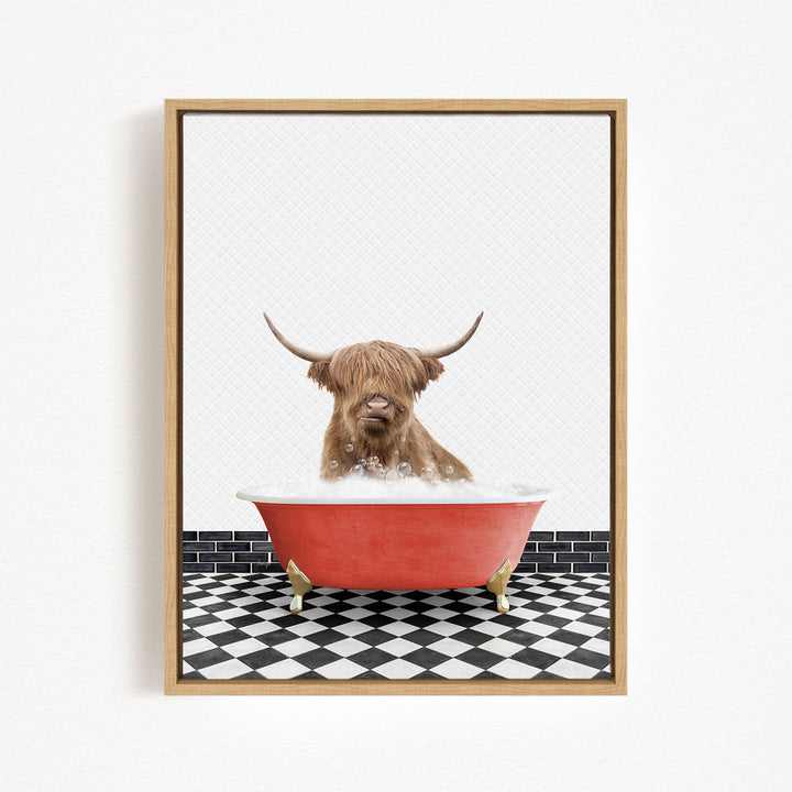 A brown cow with long horns is sitting in a red bathtub filled with bubbles, surrounded by a black and white checkered floor.
