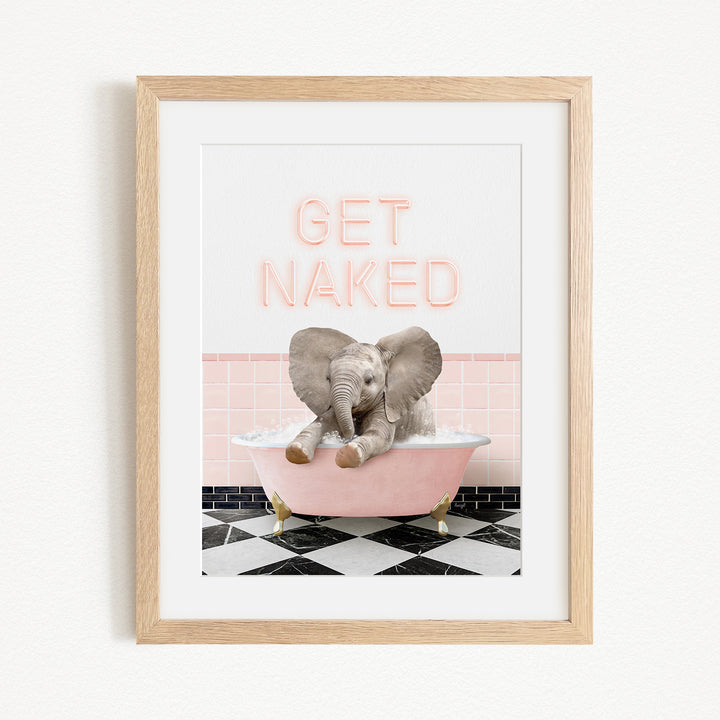 A framed image depicting a baby elephant sitting in a pink bathtub, with the text "GET NAKED" displayed above it.
