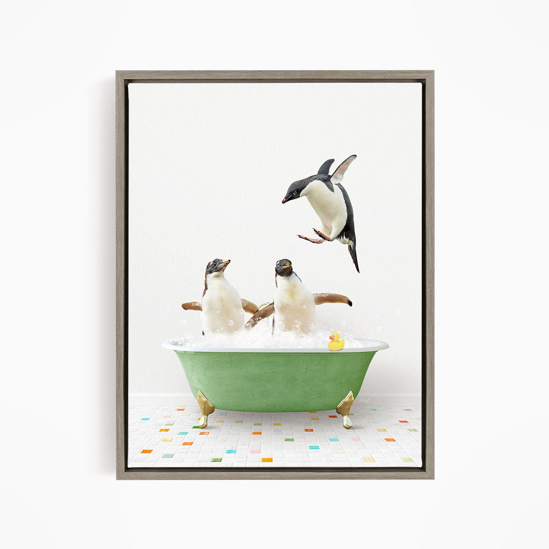 A framed image depicting two penguins sitting in a green bathtub, with one penguin flying towards the other.