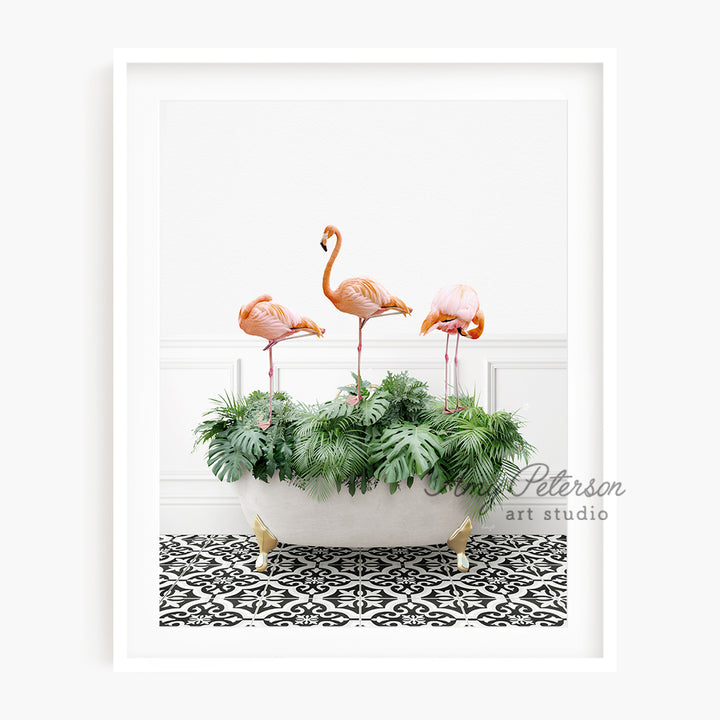 a group of pink flamingos sitting in a bathtub