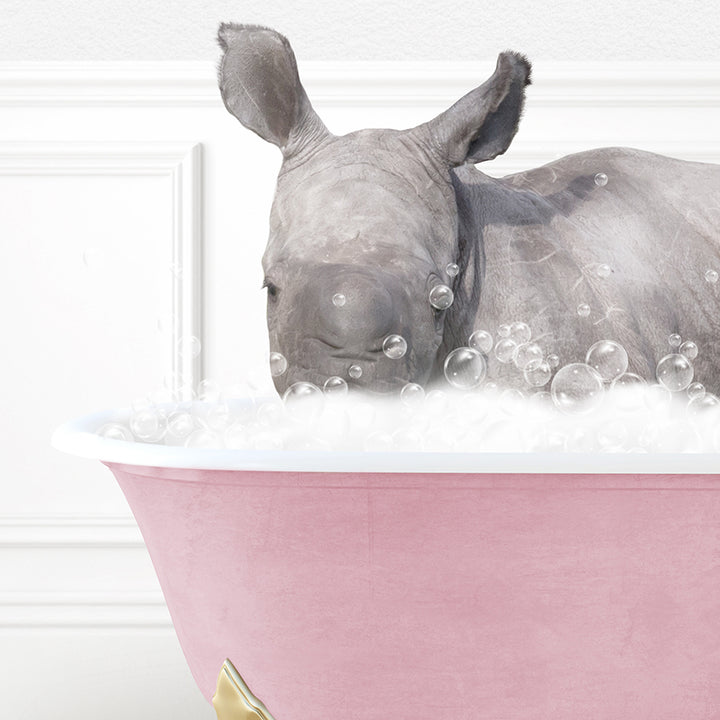 a rhino in a bathtub with bubbles on the rim