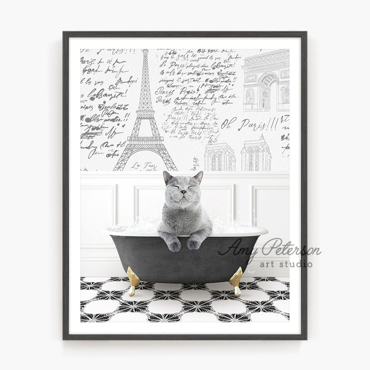 a cat sitting in a bathtub with the eiffel tower in the background