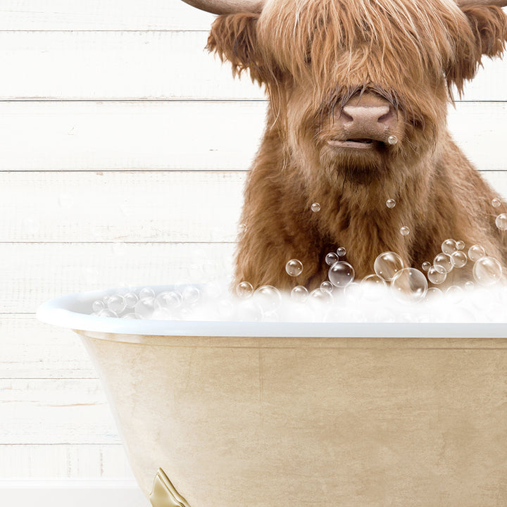 a brown cow sitting inside of a bath tub filled with bubbles