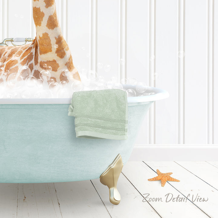 A bathtub filled with bubbles, with a towel and a starfish resting on the edge.