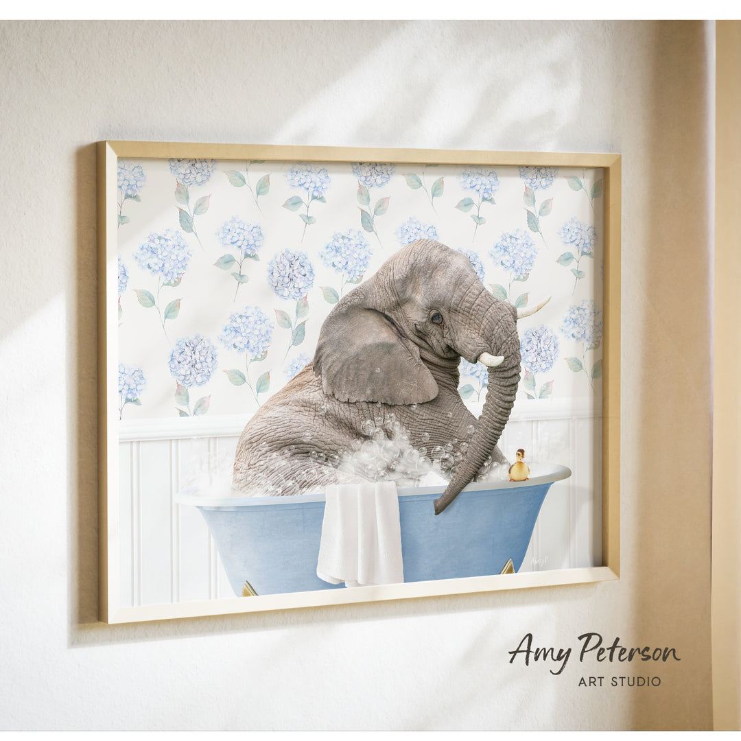 A gray elephant is sitting in a blue bathtub filled with water, surrounded by blue hydrangea flowers.