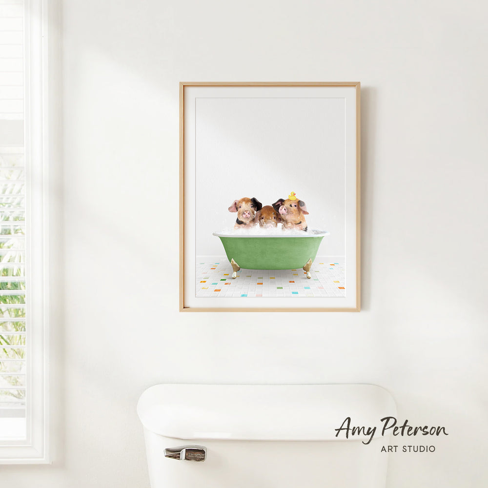 A framed print of three adorable puppies sitting in a green bathtub, with a white toilet in the foreground.