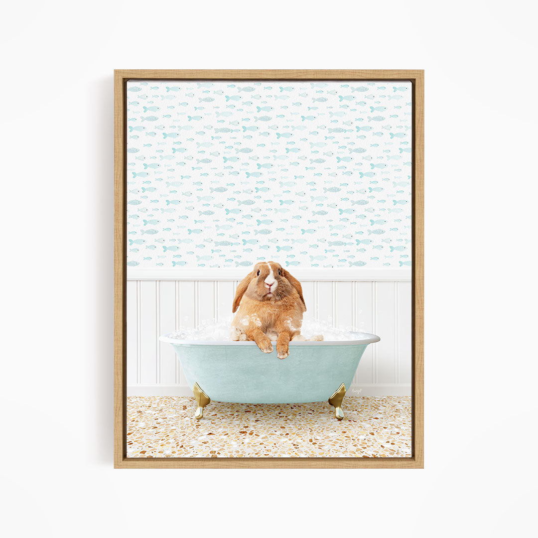 A brown rabbit sitting in a light blue bathtub filled with water, surrounded by a pattern of small fish.