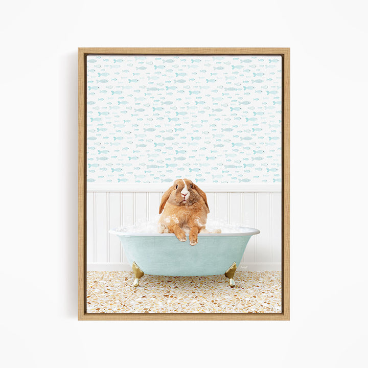 A brown rabbit sitting in a light blue bathtub filled with water, surrounded by a pattern of small fish.