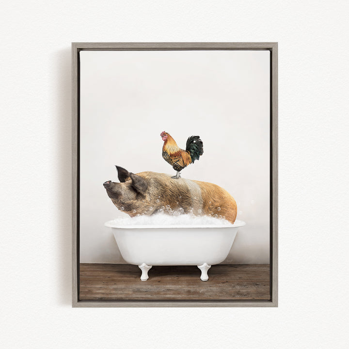 A rooster stands on a pig's back while the pig is sitting in a white bathtub filled with water.