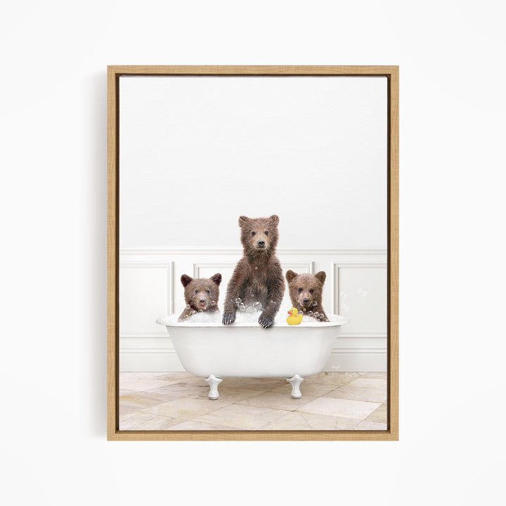 Three adorable brown bears enjoying a bath in a white bathtub, with one bear sitting on the edge of the tub and two others sitting inside.