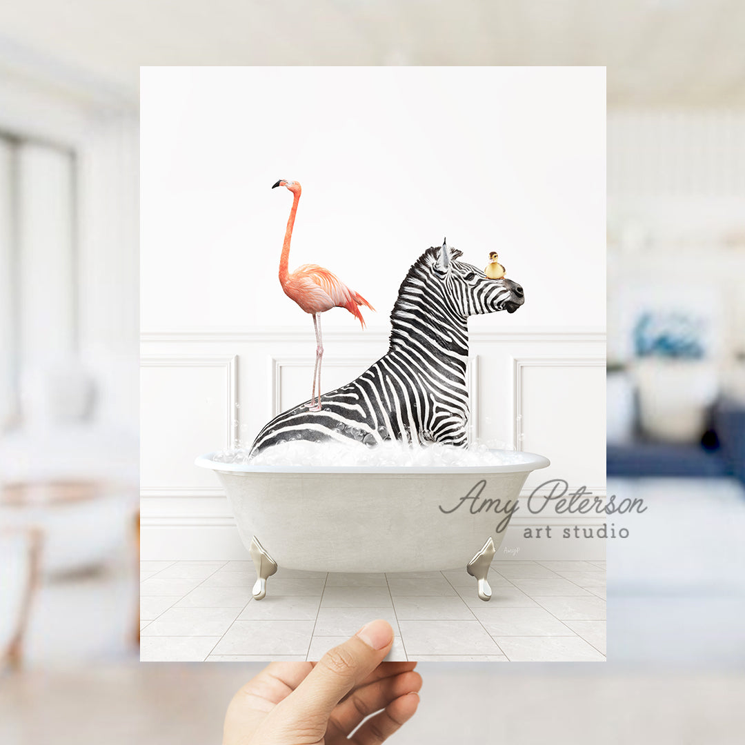 a hand holding a card with a zebra and a flamingo in a bathtub