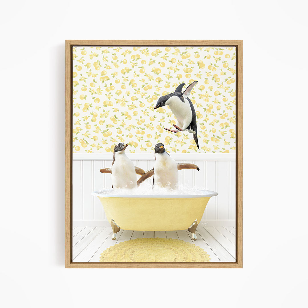 A framed image depicting two penguins sitting in a yellow bathtub, with one penguin flying towards the other in mid-air.