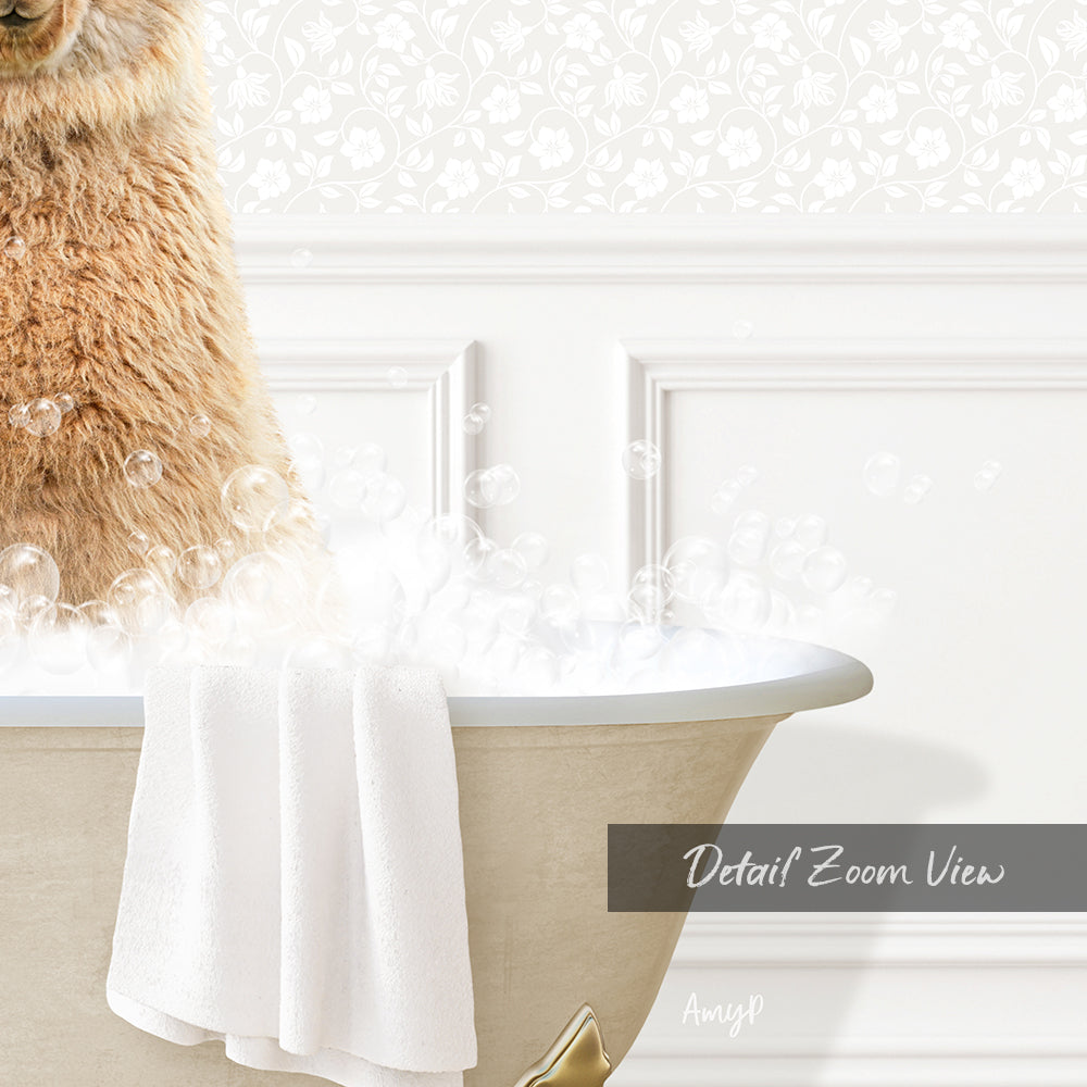 A fluffy brown cat sitting in a bathtub filled with bubbles, with a towel draped over the side.