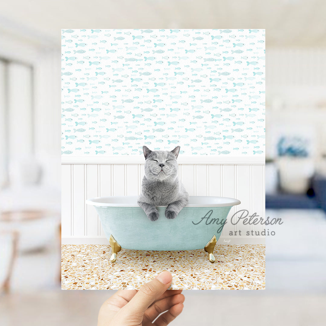 a cat sitting in a blue bath tub