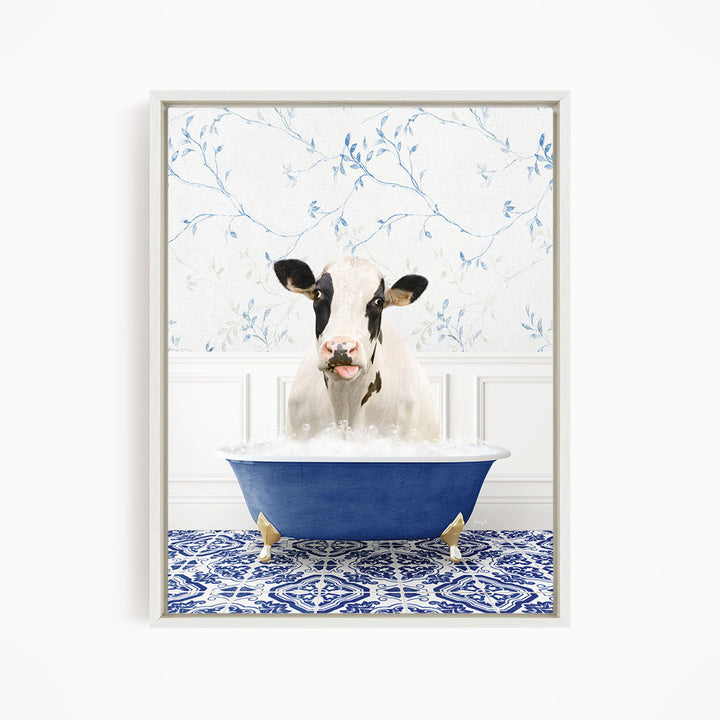 A black and white cow is sitting in a blue bathtub filled with water, creating a whimsical and humorous scene.
