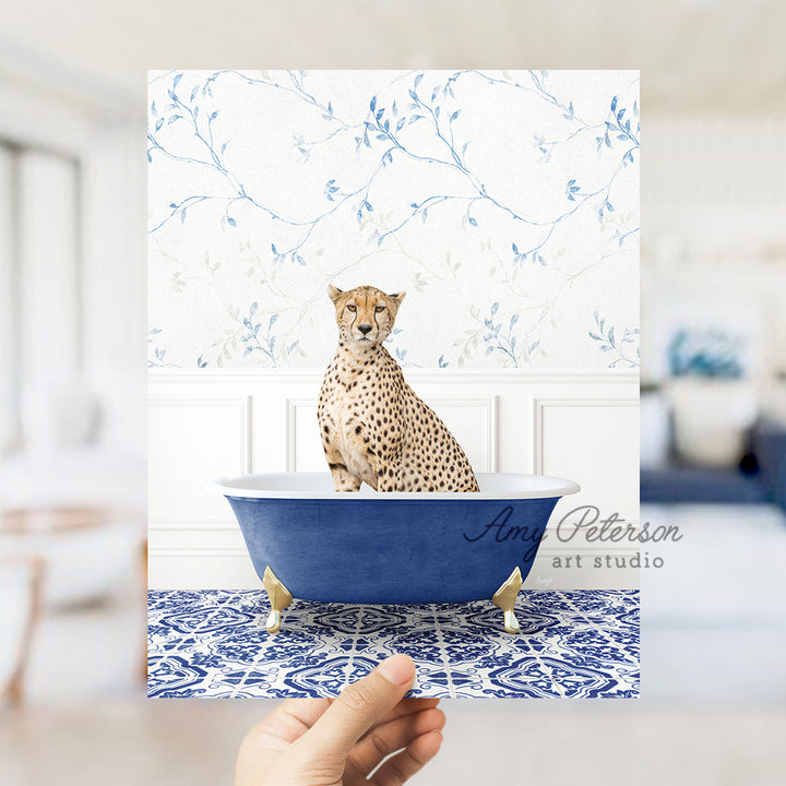 a hand holding a card with a picture of a cheetah in a bath