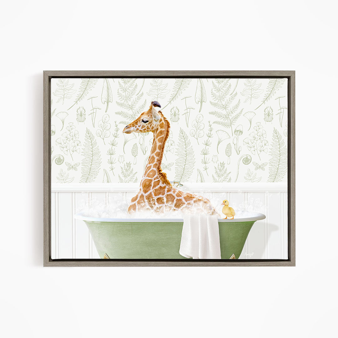 A giraffe sitting in a green bathtub filled with water, surrounded by a white wall with a green leaf pattern.