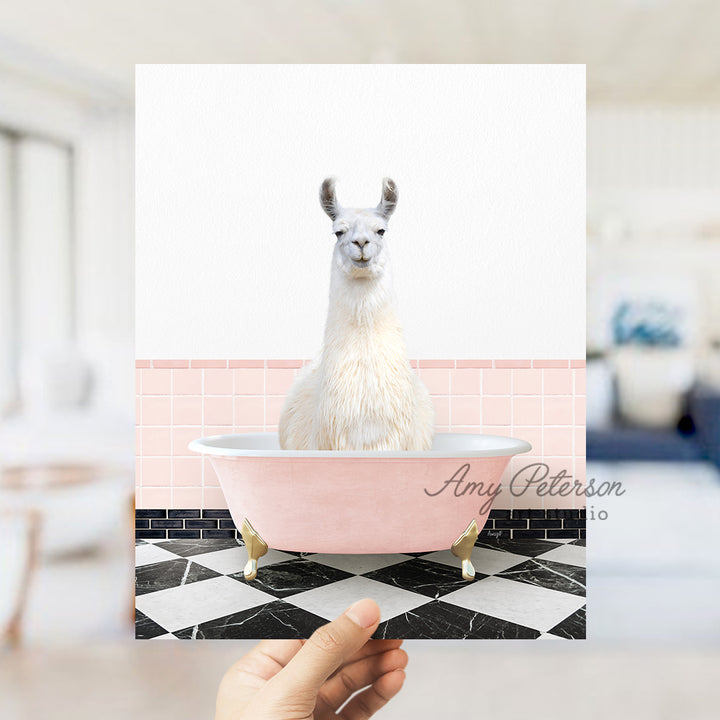 a llama sitting in a bathtub with a pink background