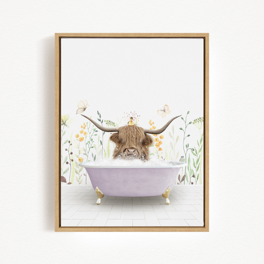A framed illustration depicting a cow with long horns sitting in a bathtub filled with bubbles, surrounded by flowers and butterflies.