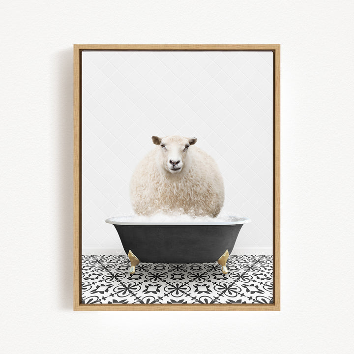 A fluffy white sheep is sitting in a black bathtub filled with bubbles, creating a whimsical and playful scene.