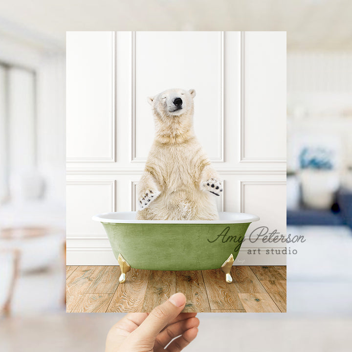 a polar bear sitting in a green bath tub