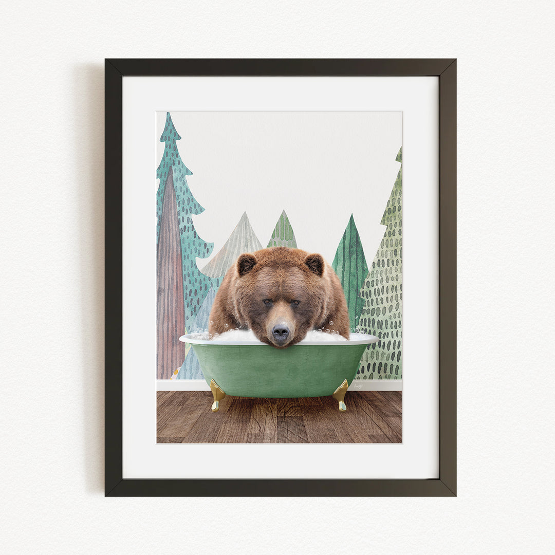 A brown bear is sitting in a green bathtub, surrounded by a forest scene with trees and a snowy landscape.
