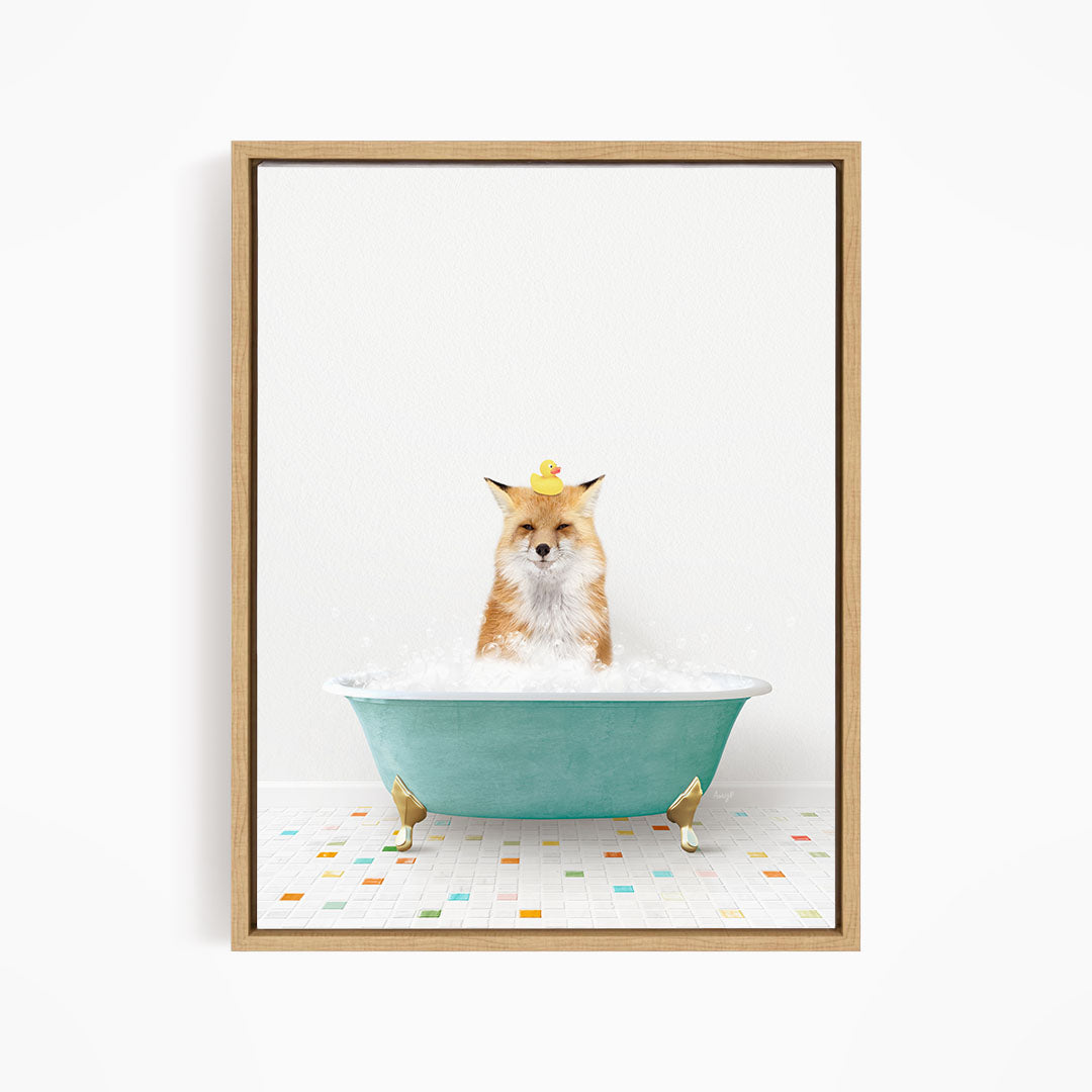 A fox is sitting in a blue bathtub filled with bubbles, with a yellow rubber duck perched on its head.