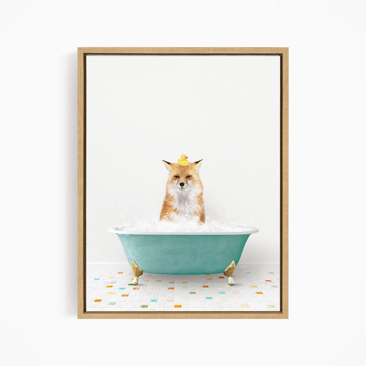 A fox is sitting in a blue bathtub filled with bubbles, with a yellow rubber duck perched on its head.