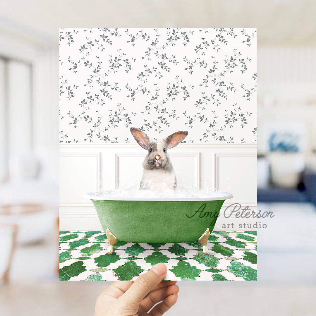 a person holding a card with a picture of a rabbit in a bathtub