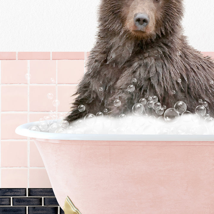 a brown bear sitting in a bathtub filled with bubbles