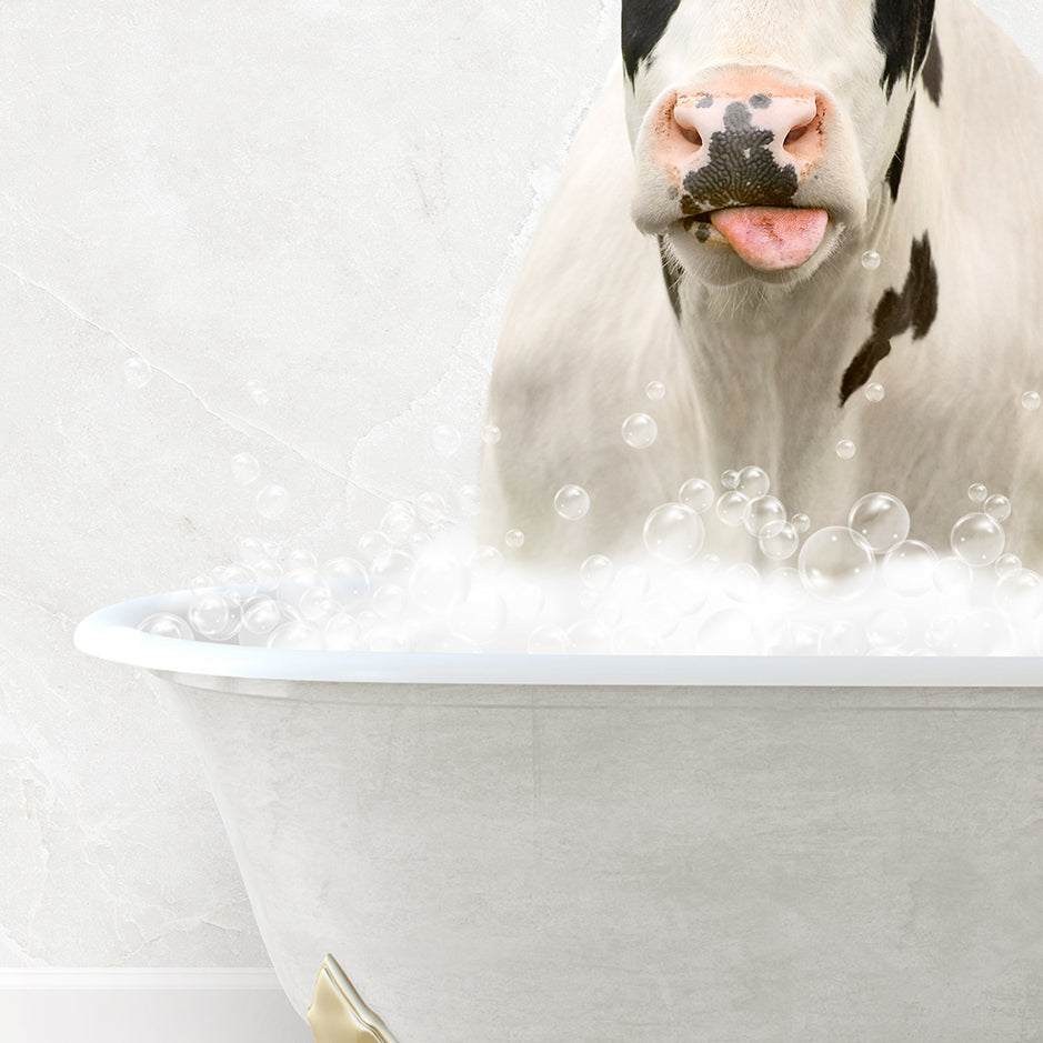 a cow sticking its head out of a bathtub filled with bubbles