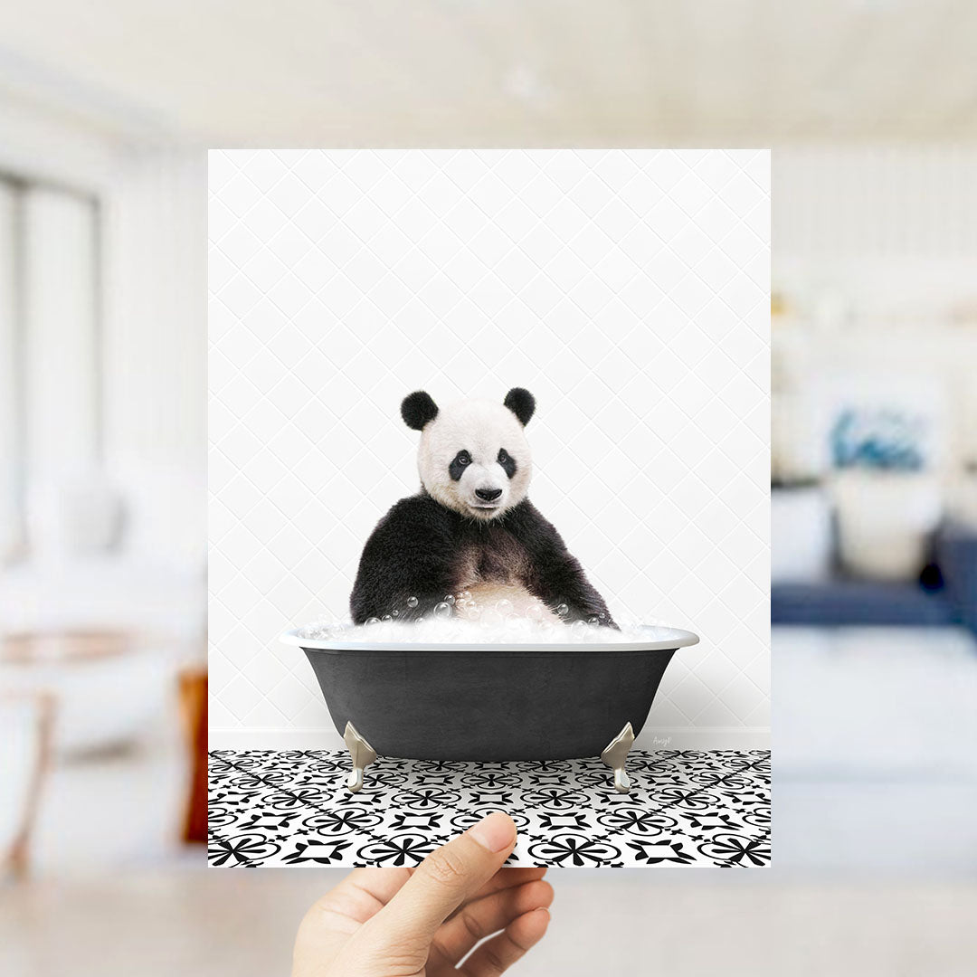 A panda bear sitting in a bathtub filled with bubbles, as if enjoying a relaxing bath.