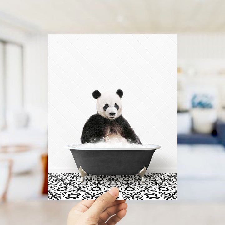 A panda bear sitting in a bathtub filled with bubbles, as if enjoying a relaxing bath.