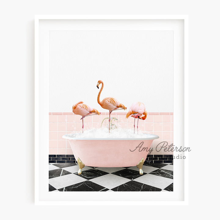 a pink bathtub with three flamingos in it