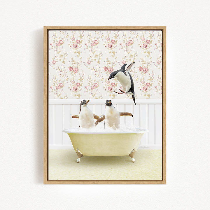 A framed image depicting two penguins sitting in a bathtub, with one penguin flying towards the other penguin.