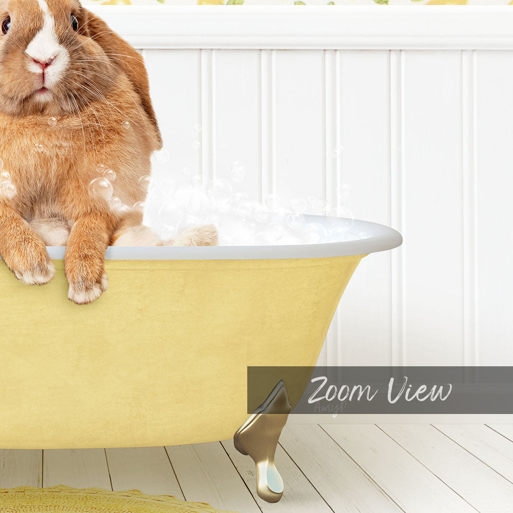A cute brown rabbit sitting in a yellow bathtub filled with bubbles, with a white wall and wooden floor in the background.