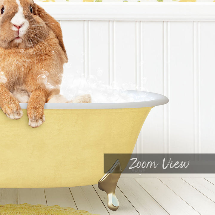 A cute brown rabbit sitting in a yellow bathtub filled with bubbles, with a white wall and wooden floor in the background.