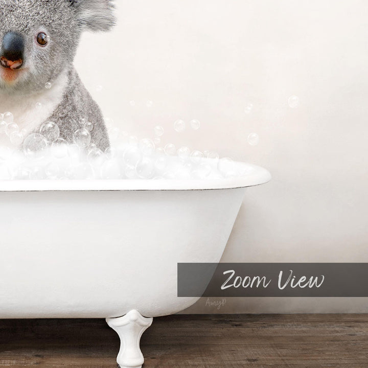 A koala sitting in a white bathtub filled with bubbles, as if enjoying a relaxing bath.