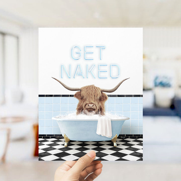 A hand holding a card with a picture of a horned animal, likely a yak or a yak dog, sitting in a bathtub filled with bubbles. The text on the card reads "GET NAKED".