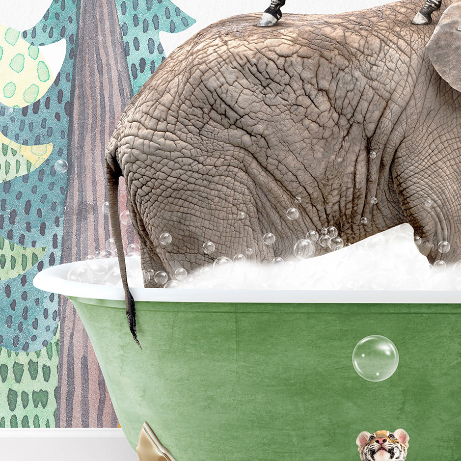 an elephant taking a bath in a green bathtub