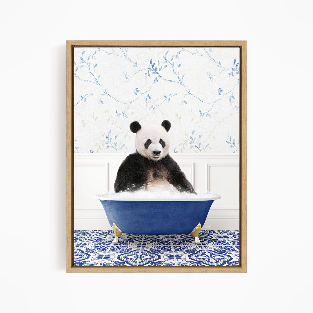 A panda bear sitting in a blue bathtub, surrounded by a blue and white floral patterned wall.