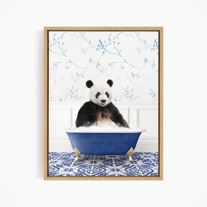 A panda bear sitting in a blue bathtub, surrounded by a blue and white floral patterned wall.