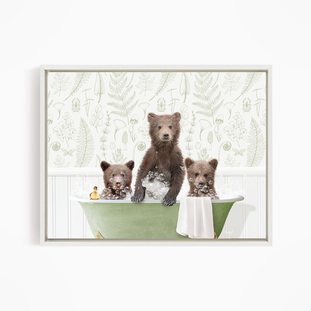 Three adorable brown bears sitting in a green bathtub, enjoying a relaxing bath.