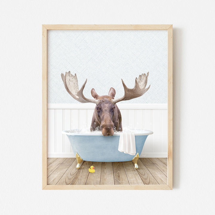 a moose is taking a bath in a bathtub