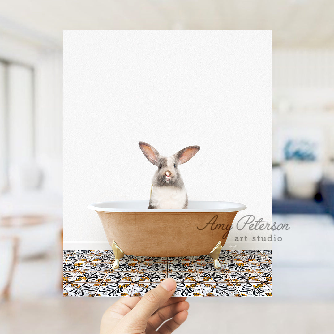 a person holding a card with a picture of a rabbit in a bathtub