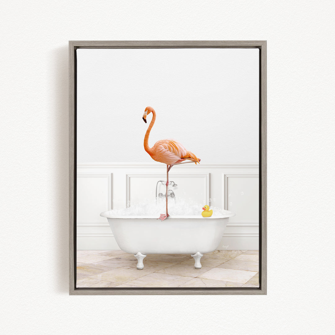 A pink flamingo stands on the edge of a white bathtub, with a yellow rubber duck floating in the water.