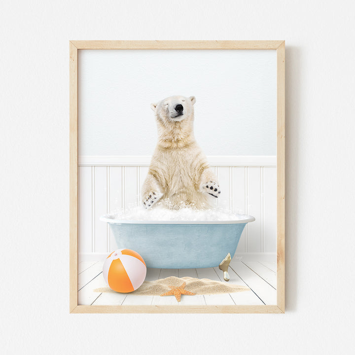 a polar bear sitting in a bathtub with a beach ball