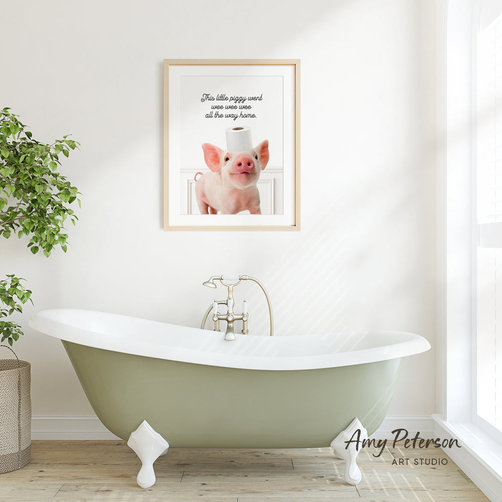 a framed picture of a pig sitting on a white bathtub, with a potted plant to the left and a window to the right.