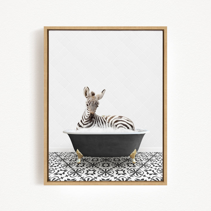 A zebra is sitting in a black bathtub with a black and white patterned floor, creating a whimsical and playful scene.